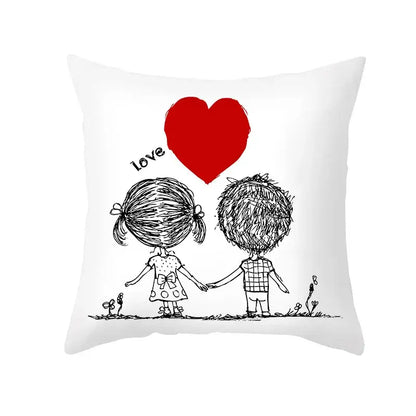 White pillow cover with black ink love heart sketch of children holding hands beneath a bold red heart design