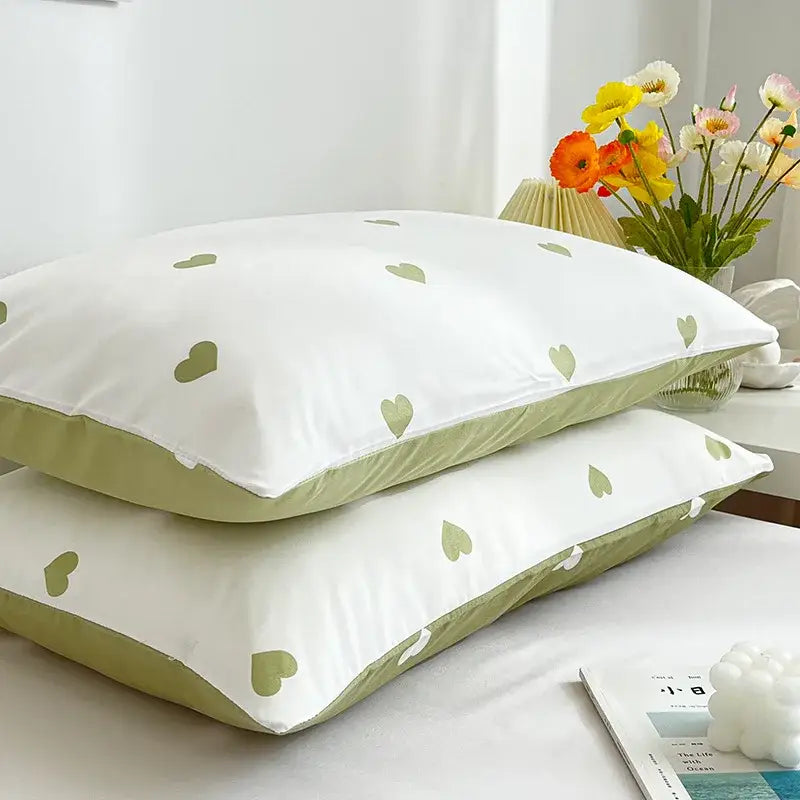 Decorbites love printed pillowcase set featuring white fabric with light green heart patterns and olive-green piping