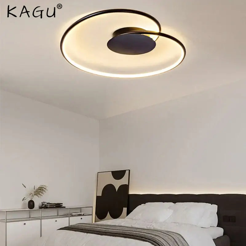 Modern decorbites love shaped ceiling light with sleek black and gold finish and illuminated ring design for versatile use
