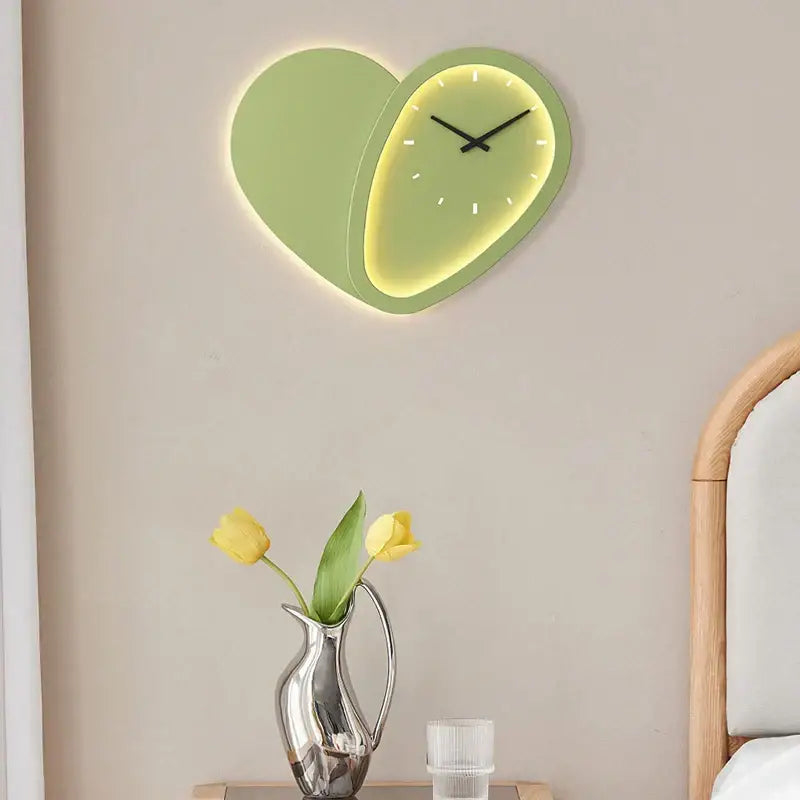 A modern lime green decorbites love shaped wall lamp clock with a minimalist dimmable indoor bedroom design