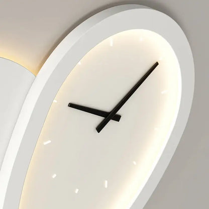 Modern oval decorbites love shaped clock wall lamp with sleek white frame and glowing backlight for indoor bedroom lighting