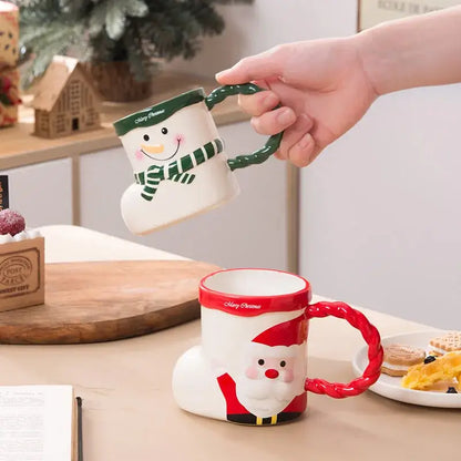 White ceramic christmas socks ceramic mug shaped like snowman with green handle and merry christmas text on rim decorbites lovely christmas