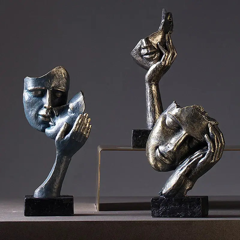 Abstract metallic sculpture of two intertwined faces on black base decorbites loving couple resin statue for interior decor