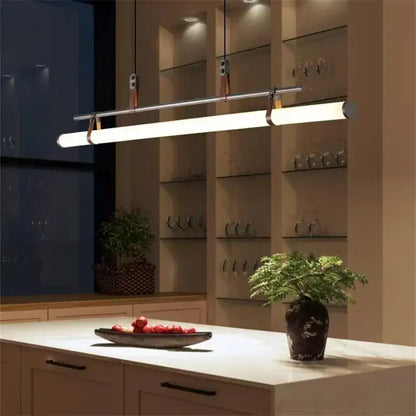 Modern minimalist decorbites lucien tube chandelier with chrome finish and warm white led, suspended by black gold leather straps