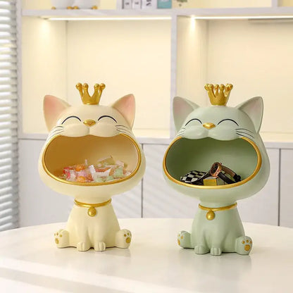 Two ceramic cat sculpture storage boxes in cream and mint green with gold crowns from DecorBites lucky cat figurines