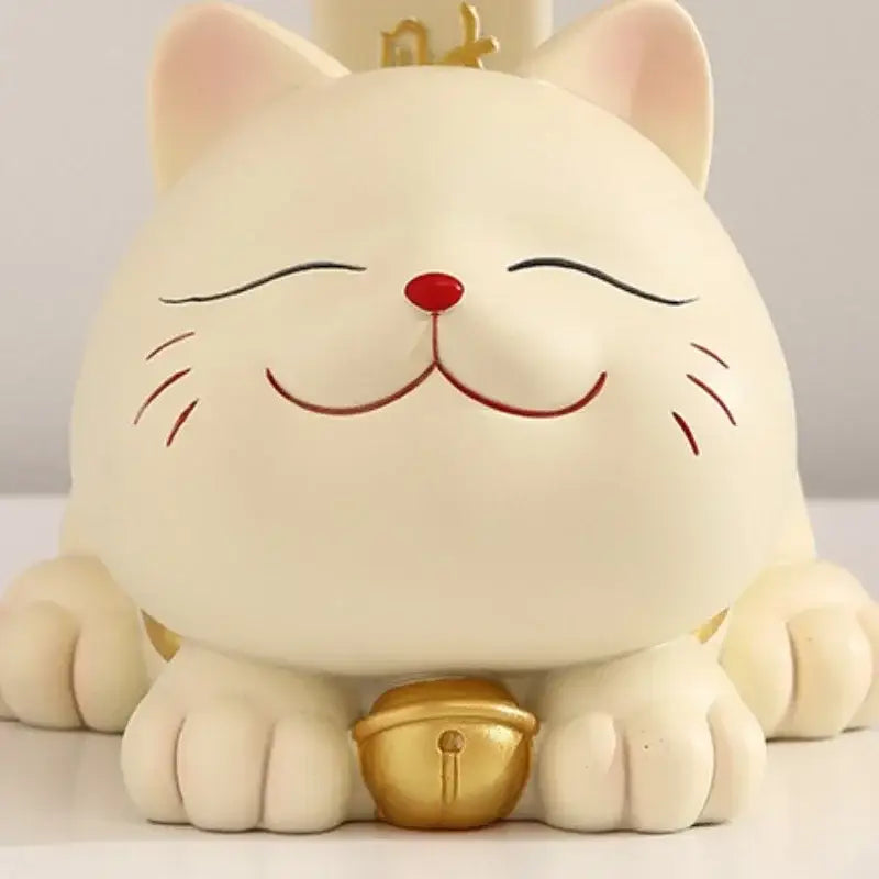 Cream-colored resin decorbites lucky cat statue with red nose closed eyes and golden bell for home decor and storage