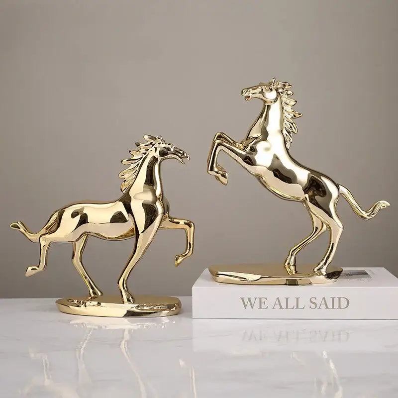 Two gold-colored polished metallic horse figurines by DecorBites lucky horse resin for elegant horse resin home decor