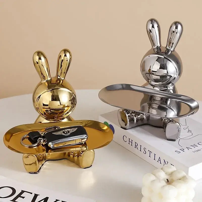 Gold and silver metallic lucky rabbit key trays by decorbites holding skateboard shaped trays for stylish organization