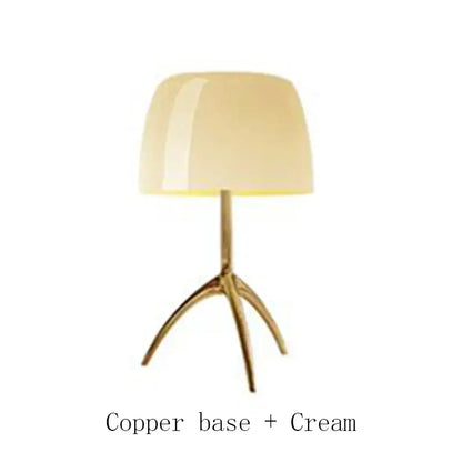 Cream-colored glossy lampshade table lamp with sleek copper tripod base by decorbites lumiere piccola chrome