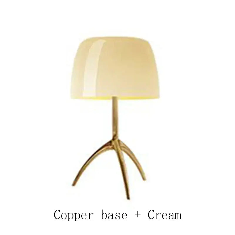 Cream-colored glossy lampshade table lamp with sleek copper tripod base by decorbites lumiere piccola chrome