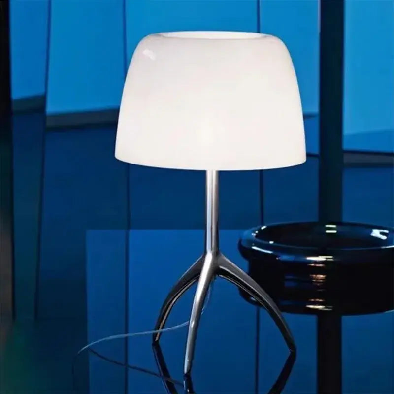 Modern white table lamp with sleek minimalist design and chrome tripod base decorbites lumiere piccola chrome model