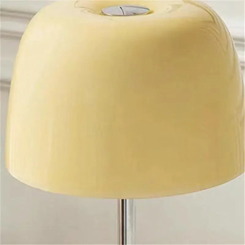 Cream-colored smooth lampshade with subtle glossy finish on decorbites lumiere piccola chrome table lamp for bedside use