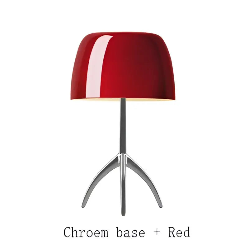 A sleek glossy red table lamp with a chrome tripod base decorbites lumiere piccola chrome for bedside use