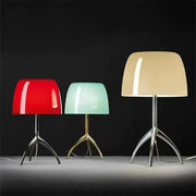 Three modern decorbites lumiere piccola chrome table lamps with glossy dome shades in red mint green and beige on tripod bases