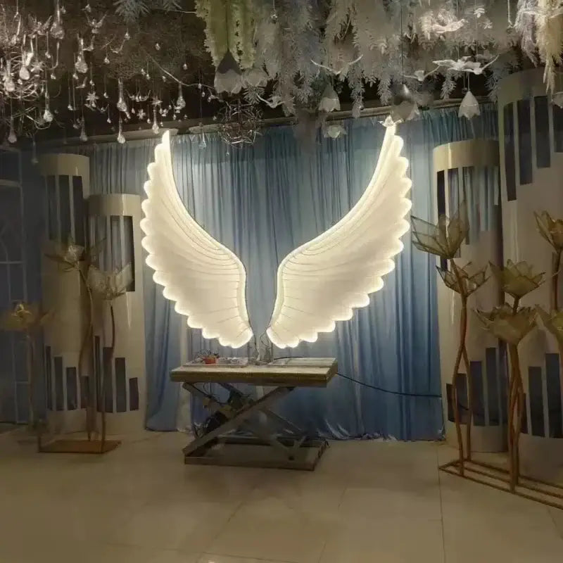 Illuminated white angel wings with glowing edges by decorbites luminescent angel for party and stage decor