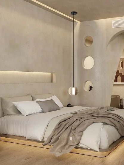 Modern minimalist bed with sleek wooden frame and upholstered headboard paired with decorbites lunar stone pendant chandelier in soft beige and gray hues