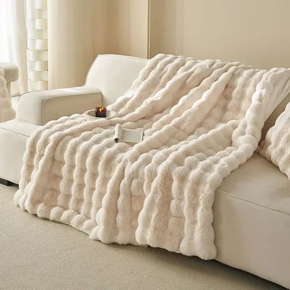 Cream-colored decorbites luxe faux rabbit fur blanket with plush chunky knit texture for cozy autumn winter sofa cover