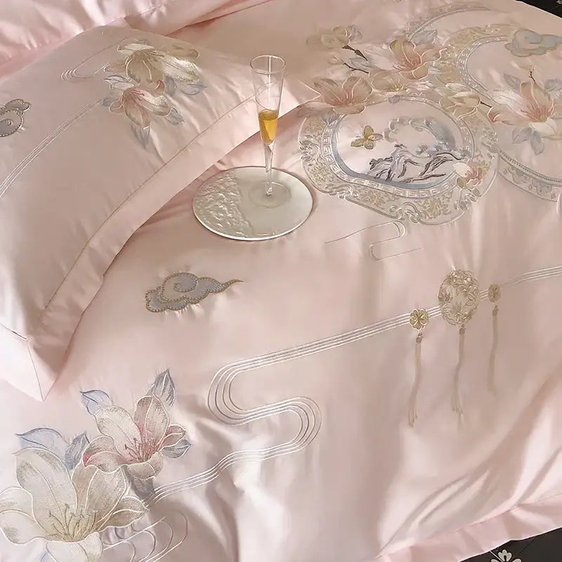 Pink satin bedding set with intricate gold and silver floral embroidery from decorbites luxe floral bird collection