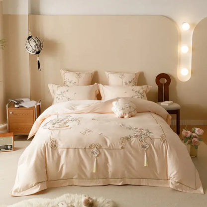 Beige satin bedding set with intricate floral embroidery and tassels made from Egyptian cotton by DecorBites Luxe Flowers
