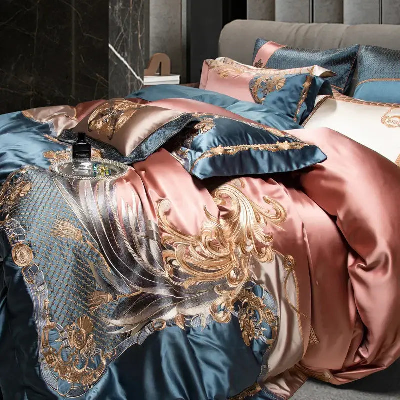Luxurious decorbites luxe gold bedding set in deep blue satin with rose gold and intricate luxe gold embroidery
