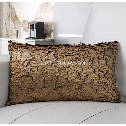 Brown textured cushion cover with cracked bark-like surface and frayed edges from decorbites luxe gold foil collection