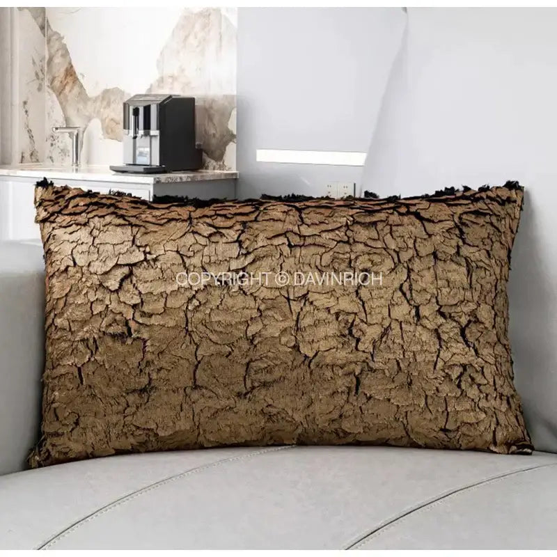 Brown textured cushion cover with cracked bark-like surface and frayed edges from decorbites luxe gold foil collection