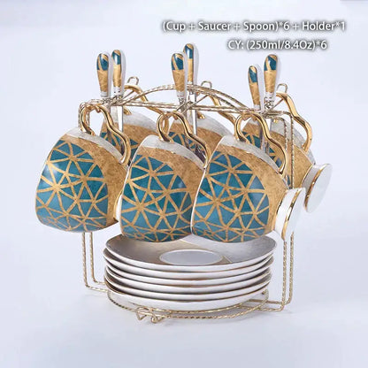 Set of six blue and gold geometric bone china cups with saucers spoons and golden rack from decorbites luxe gold inlay coffee set