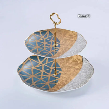 Two-tiered serving platter with blue and gold geometric pattern and decorbites luxe gold inlay coffee set accents