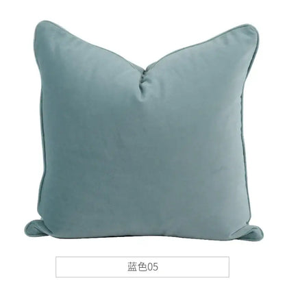 A soft square decorbites luxe italy velvet pillowslip in muted teal blue with stitched edges for living room sofa