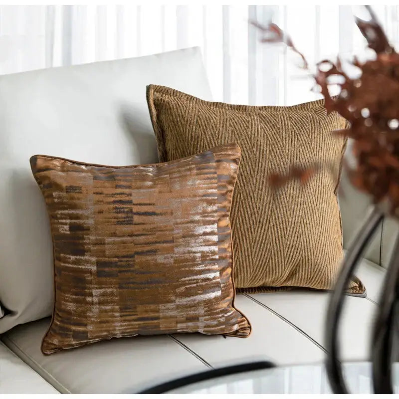 A square brown gold coffee color cushion cover with metallic bronze and gold abstract pattern by decorbites luxe jacquard