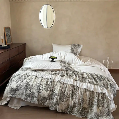 Decorbites luxe lace ruffles bedding set with layered ruffled bedspread featuring gray botanical print on off-white satin base