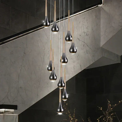 Modern black and gold teardrop pendant lights in decorbites luxe loft chandelier for living room or hotel interiors