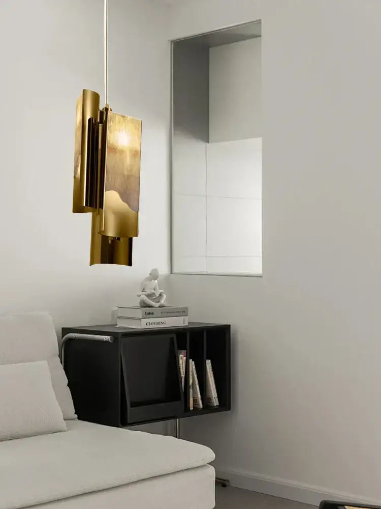 A modern tiered gold decorbites luxe marble pendant light with sleek geometric design for kitchen island lighting