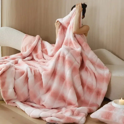 A plush decorbites luxe milk velvet blanket in gradient pink and white with a soft fuzzy texture for home and office use