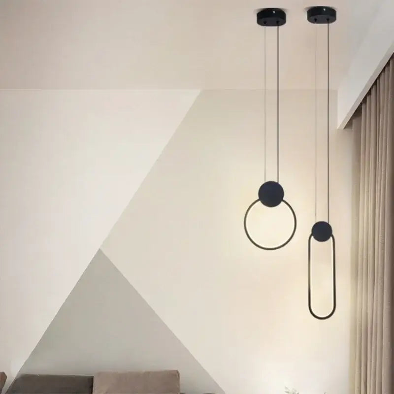 Modern black minimalist pendant light with circular and oval rings for home decor by DecorBites Luxe Nordic Circle lamp