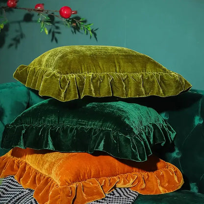Stacked velvet euro pillow shams in olive green deep emerald and burnt orange with ruffled edges by decorbites