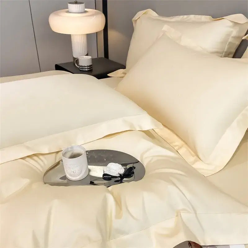Cream-colored satin duvet cover and fitted sheet with elegant stitched edges from decorbites 1000tc egyptian cotton set
