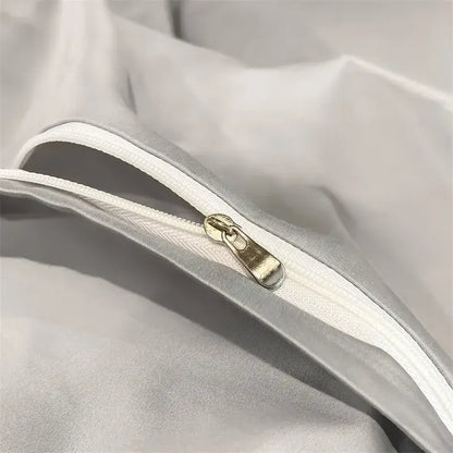 Silver-toned zipper with metallic pull tab on soft white Egyptian cotton duvet cover from DecorBites luxurious bedding set