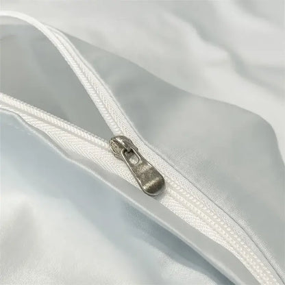 Silver-toned zipper pull on white satin-like fabric of DecorBites™ luxurious 1000TC egyptian cotton duvet cover