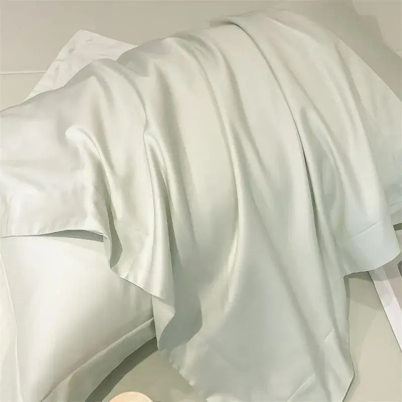 A soft off-white satin pillowcase from decorbites luxurious 1000tc egyptian cotton bedding set with smooth texture