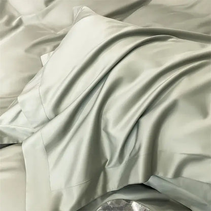 A soft light gray satin pillowcase with a smooth glossy finish from the DecorBites™ luxurious 1000TC Egyptian cotton bedding set including duvet cover and fitted sheet