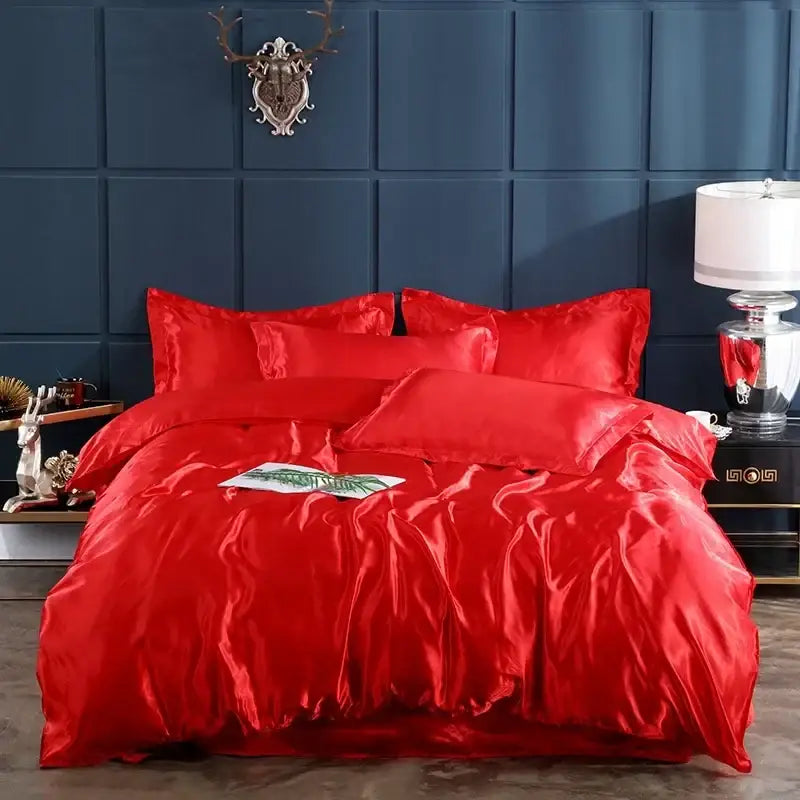 Vibrant red satin bed sheet and duvet cover with glossy luxurious finish in decorbites™ luxurious bedding ensemble for width bed