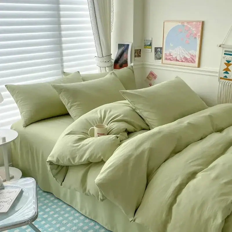 Soft sage green cotton bedding set with matching pillows and a cozy duvet cover for single and couple beds by DecorBites