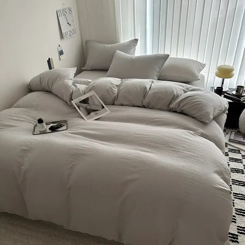 DecorBites™ luxurious cotton bedding set features an off-white duvet cover with matching pillows and soft texture