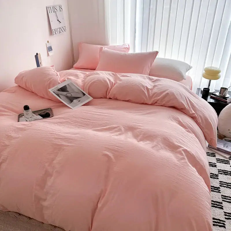 Soft blush pink cotton bedding set featuring a cozy slightly wrinkled texture for luxury duvet cover comfort