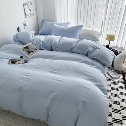 Light blue cotton bedding set from DecorBites Luxurious Cotton Bedding Set featuring soft, cozy texture and matching pillows