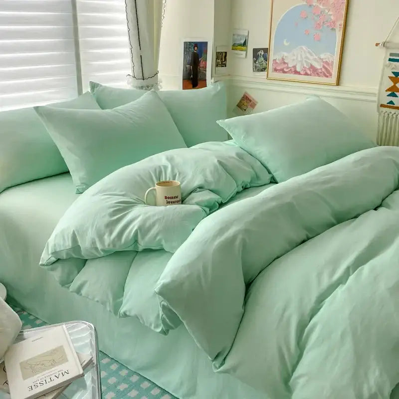 Mint green quilted cotton bedding set with matching duvet cover pillows and bed skirt from DecorBites Luxurious collection