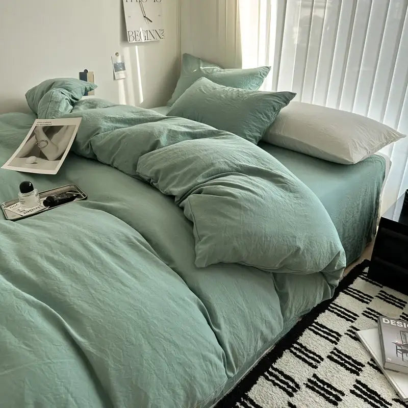 Soft mint green linen duvet cover with matching pillows and white accent pillow in DecorBites™ cotton bedding set