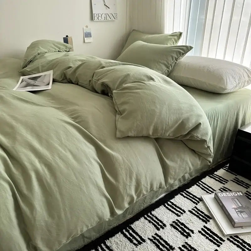 Soft sage green cotton bedding set featuring a luxurious linen duvet cover with matching pillows by DecorBites