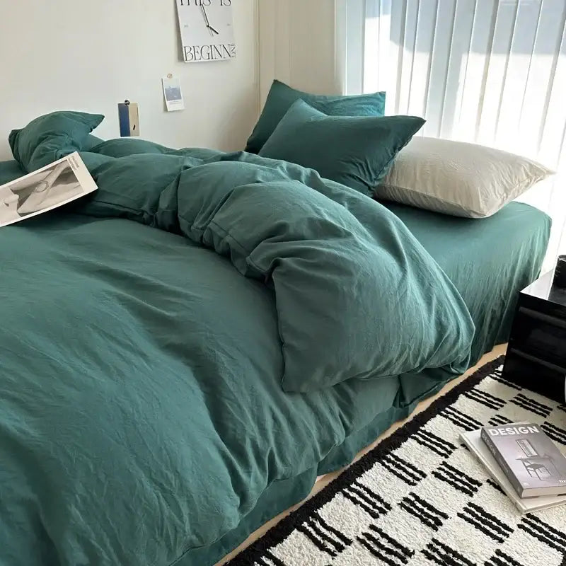 Teal-colored soft textured cotton bedding set with matching pillows and rumpled duvet cover by decorbites